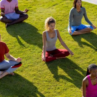 men and women doing yoga