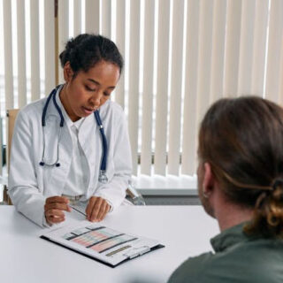 doctor explaining a chart to her patient