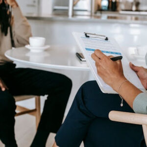 Therapist taking notes during a session