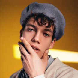 man touching his own face seductively