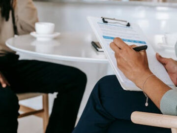 Therapist taking notes during a session