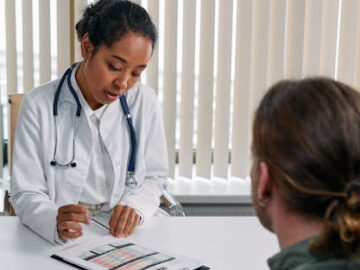 doctor explaining a chart to her patient