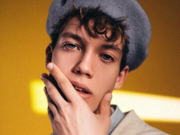 man touching his own face seductively